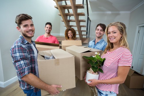 Packed moving boxes and furniture ready for removals