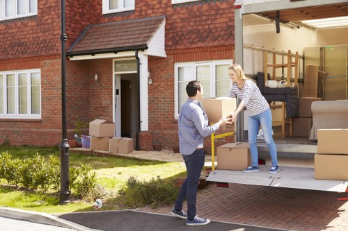 Moving van and packed boxes during a Shoreditch home relocation