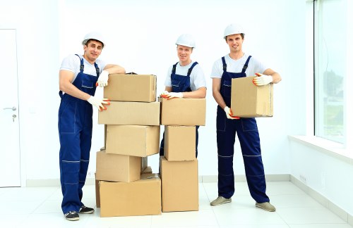 Trained removal staff handling boxes with care in Shoreditch