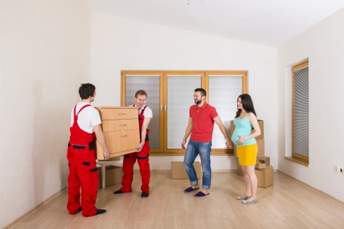 Professional movers organizing items in a Shoreditch flat