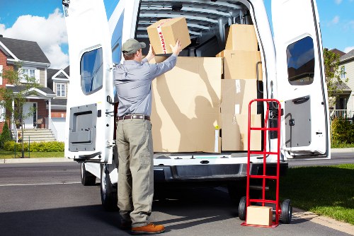 Removal team handling furniture during a flat move in Shoreditch