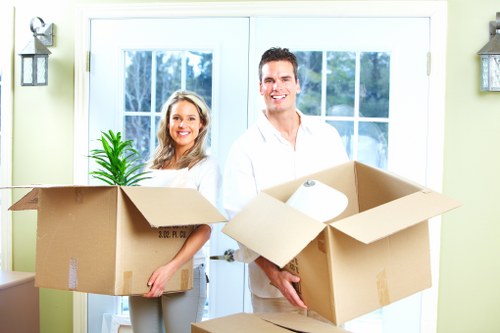 Expert movers handling fragile belongings during packing services in Shoreditch